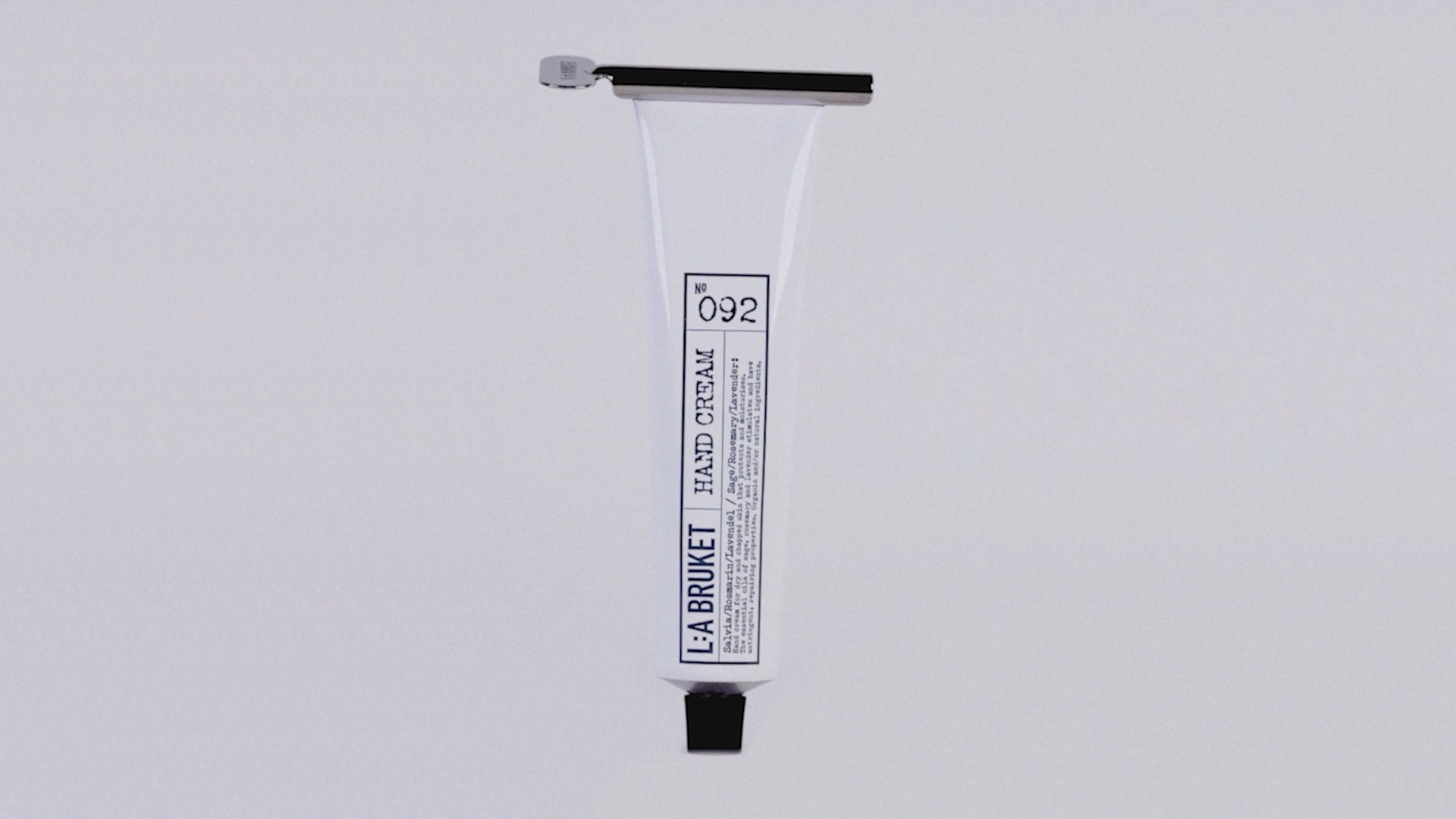 Load video: <p><span class="metafield-multi_line_text_field">Slide the Hand Cream Key onto the base of your tube and gently roll upward to dispense every last drop of hand cream. </span></p>
